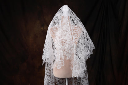 a white veil on a mannequin head