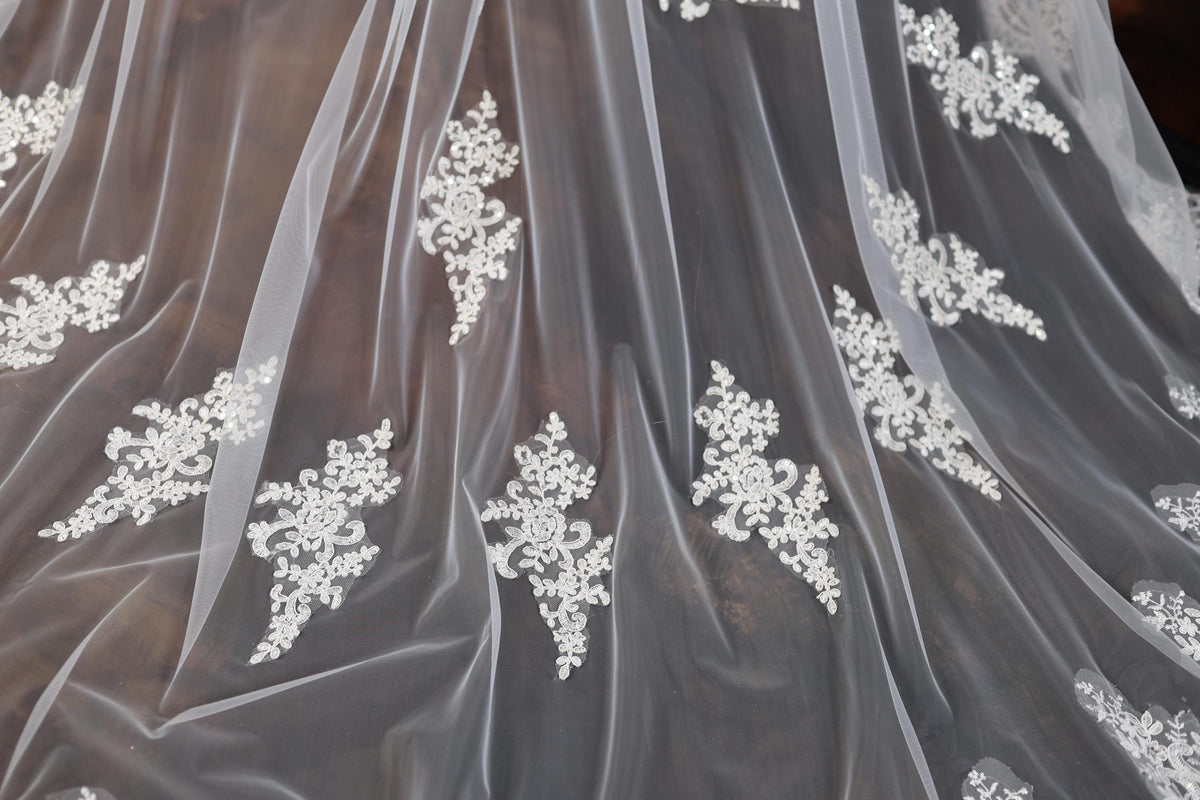 a close up of a wedding dress with a veil