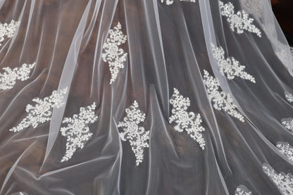 a close up of a wedding dress with a veil