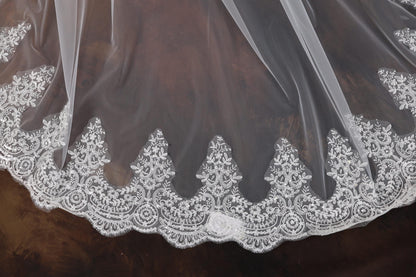 a close up of a wedding veil on a table