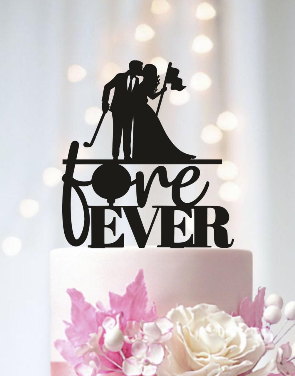 A black silhouette of a bride and groom holding a flag on top of a white wedding cake with the words "forever" written on it.