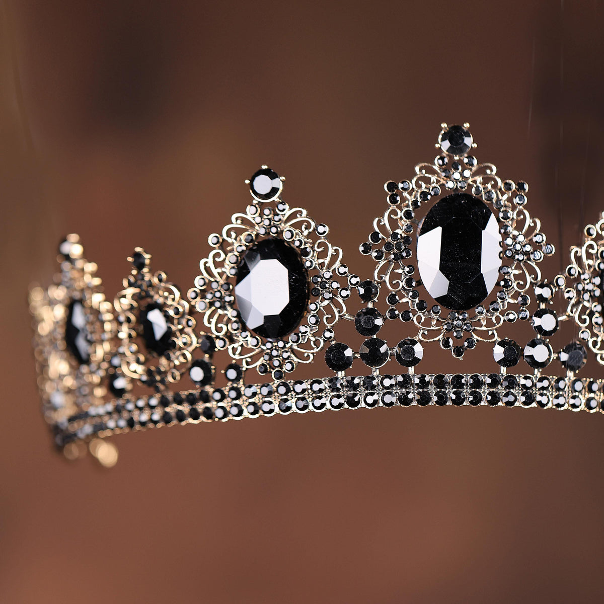 a black and white tiara on a brown background