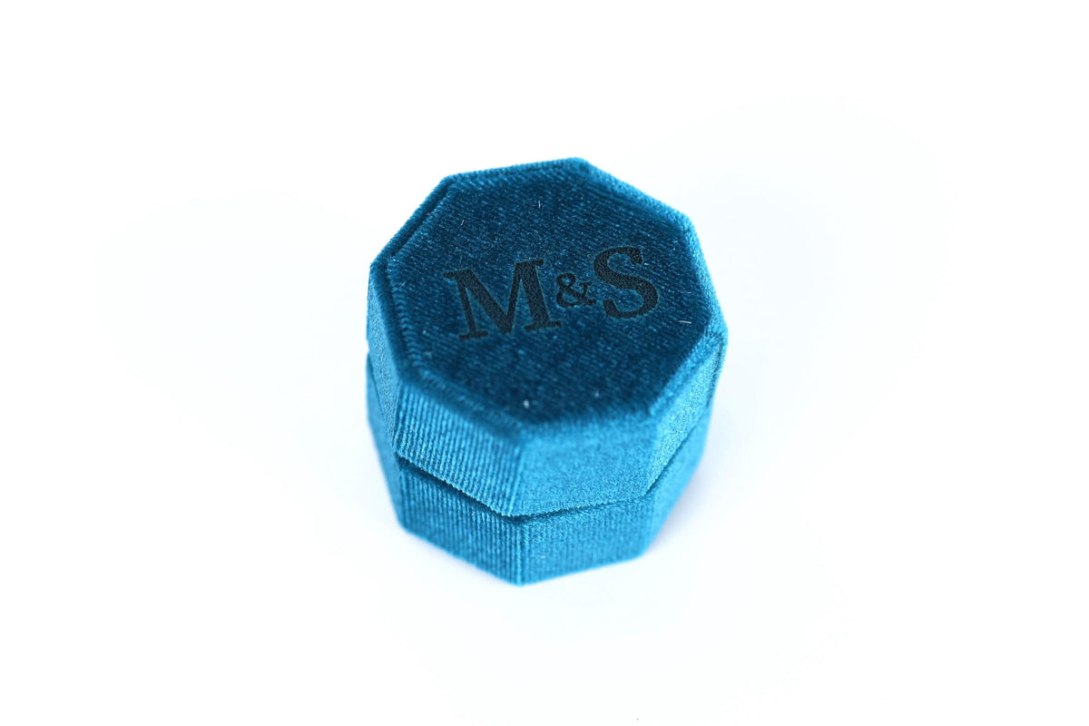A blue, octagonal box with the letters "M&S" embossed on it.