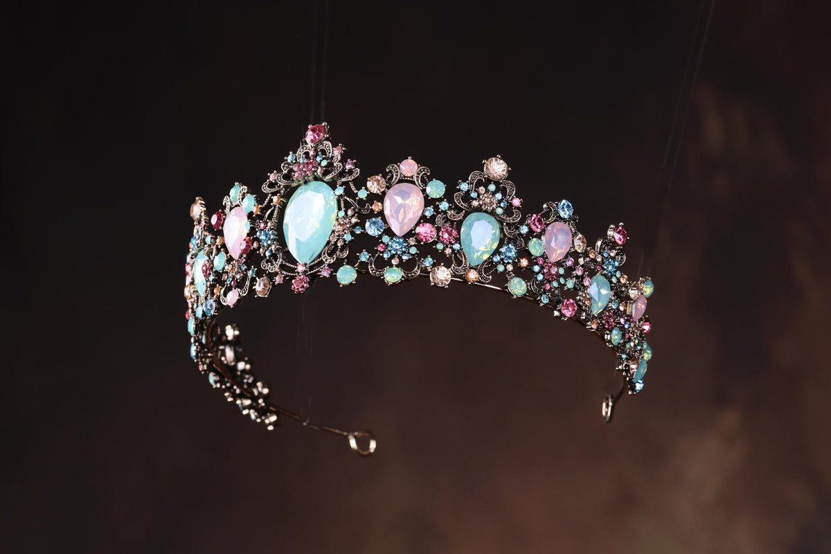 a tiara with pastel blue and pink stones