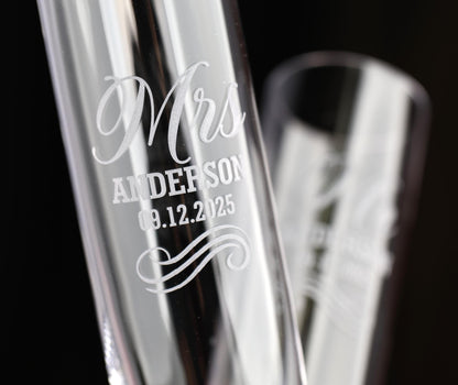 a couple of glass vases sitting on top of a table