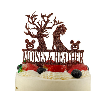 A cake with a decorative topper featuring a silhouette of a couple embracing, surrounded by various fruits and berries.