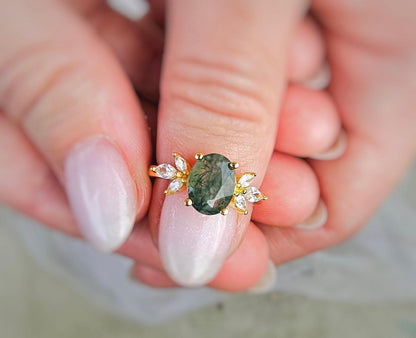 a close up of a person holding a ring
