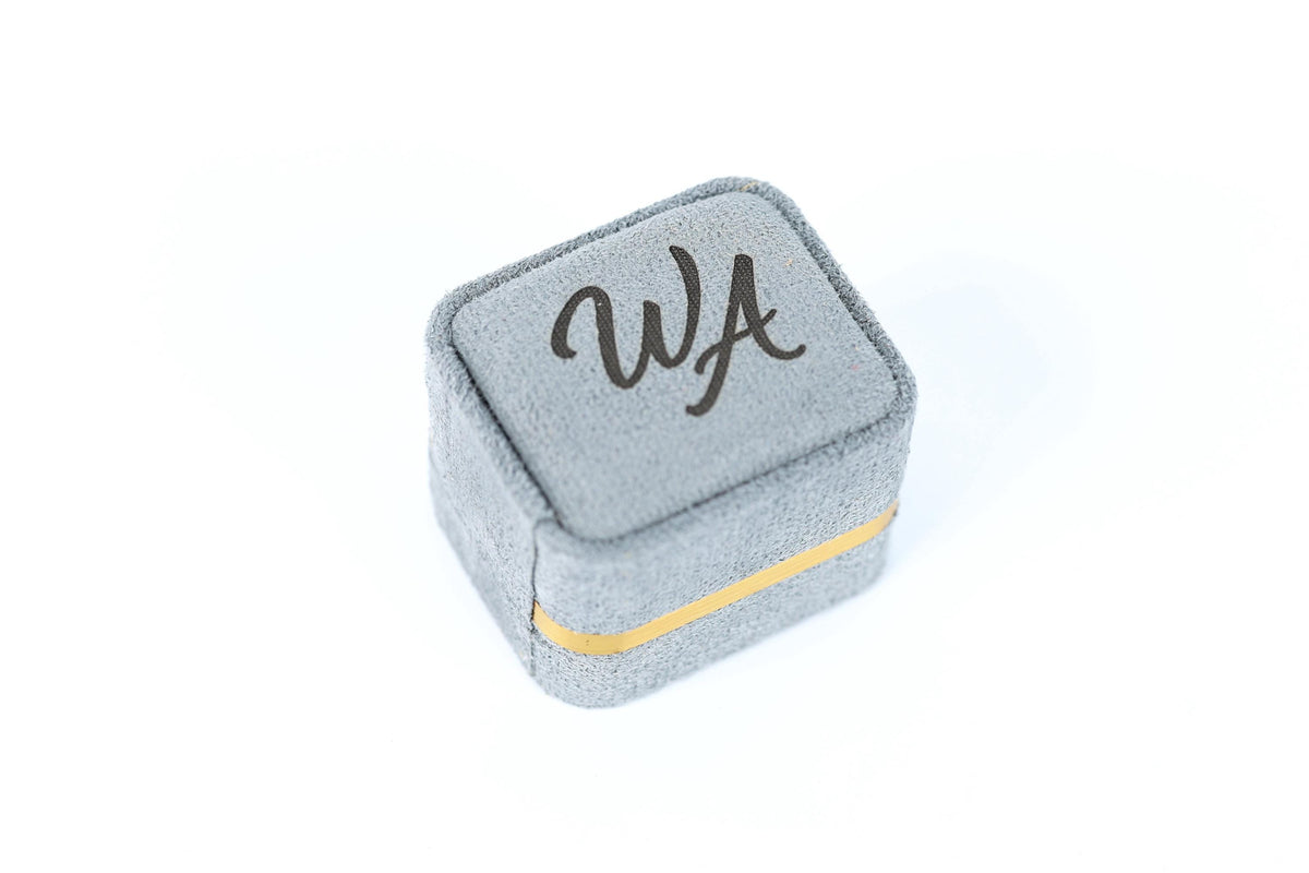 A gray fabric box with the word "WA" printed on it.