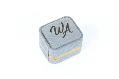 A gray fabric box with the word "WA" printed on it.