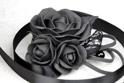 a close up of a flower on a ribbon
