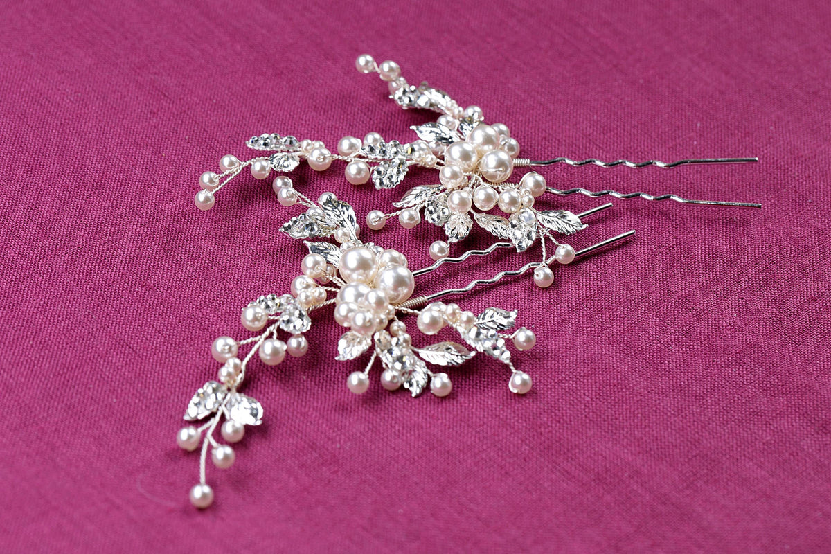 a close up of a hair comb with pearls