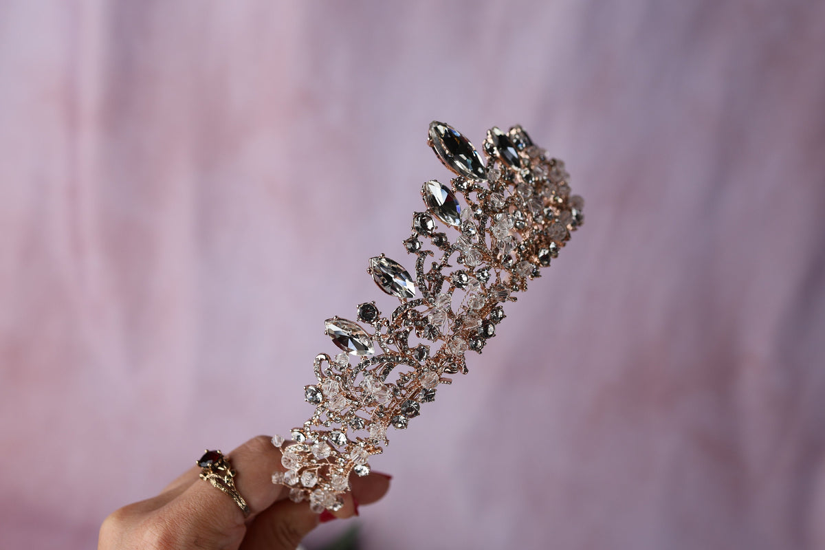 a woman's hand holding a crystal bridalt