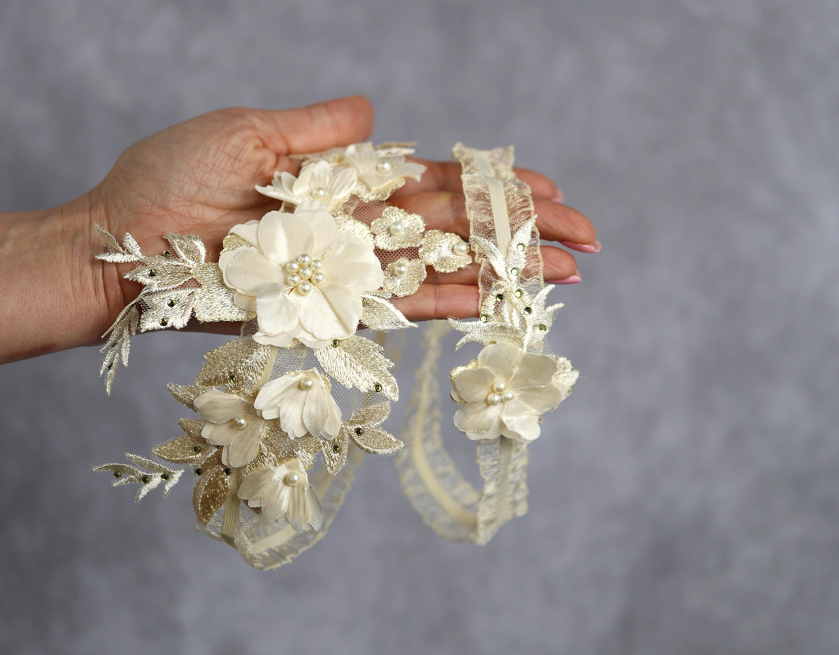 a hand holding a bunch of white flowers