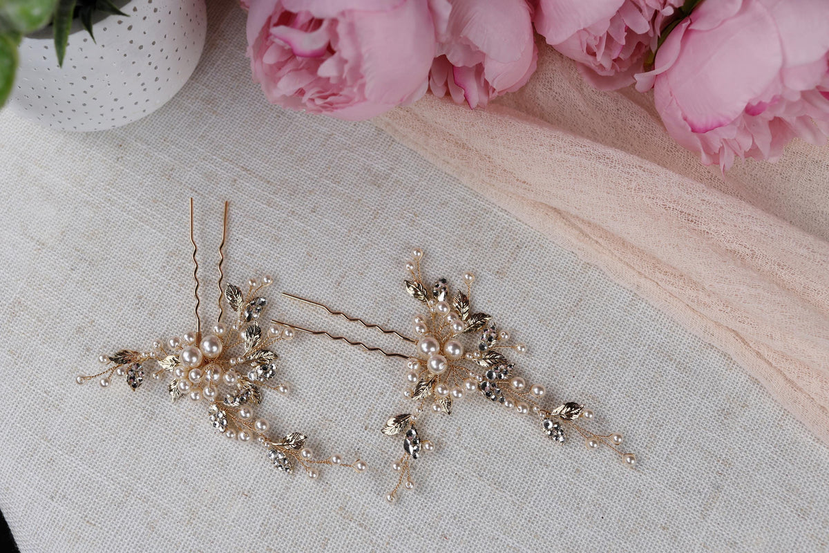 a close up of a pair of earrings on a table