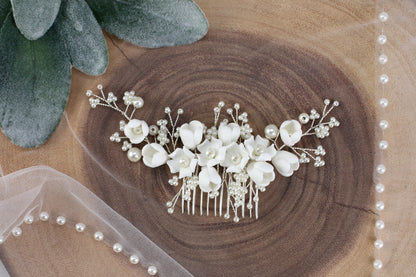 a bridal hair comb with flowers and pearls
