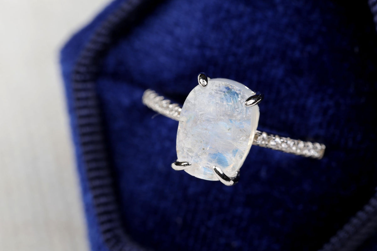 a ring with a large white stone in it