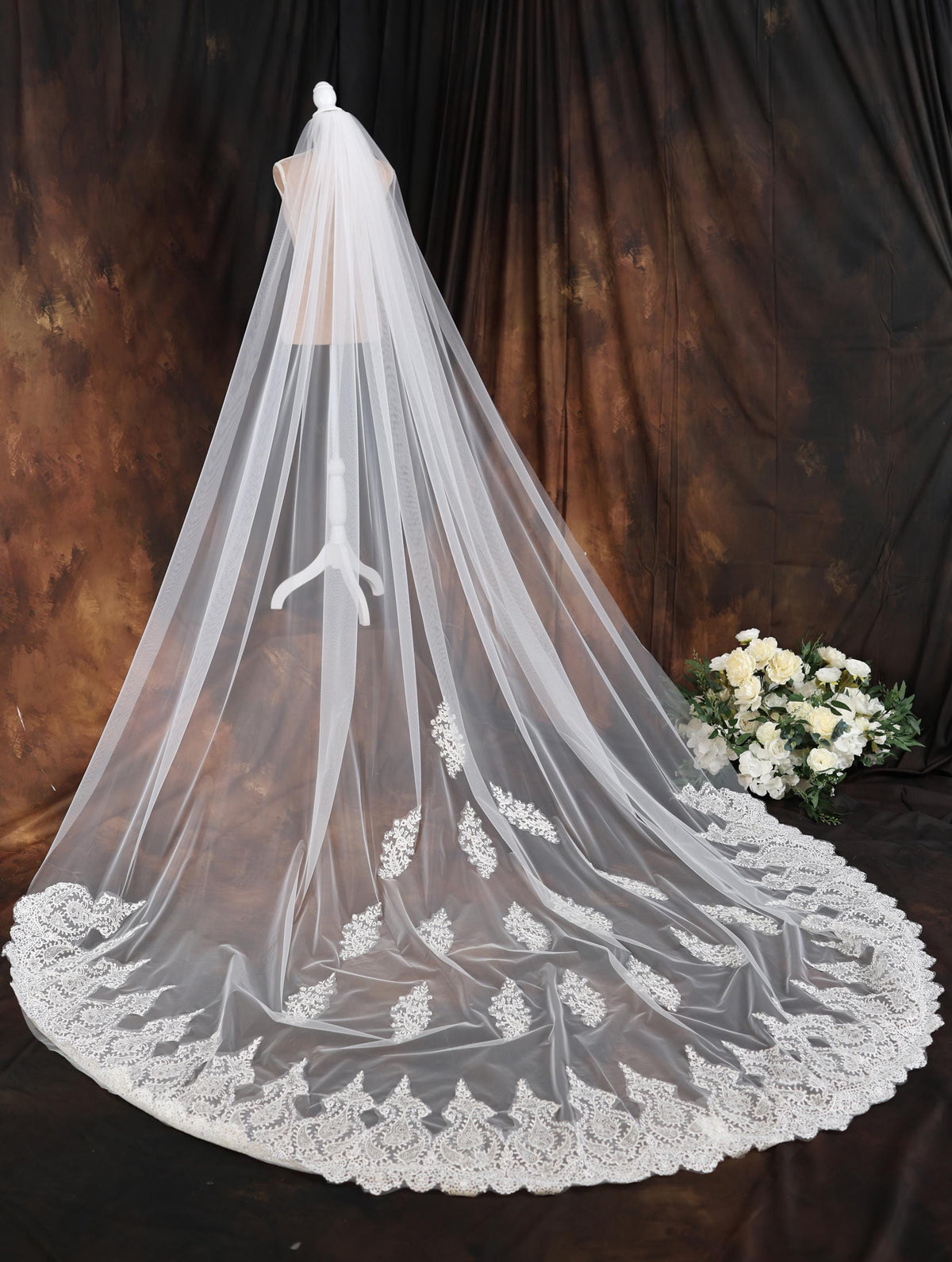 a white wedding veil on a mannequin