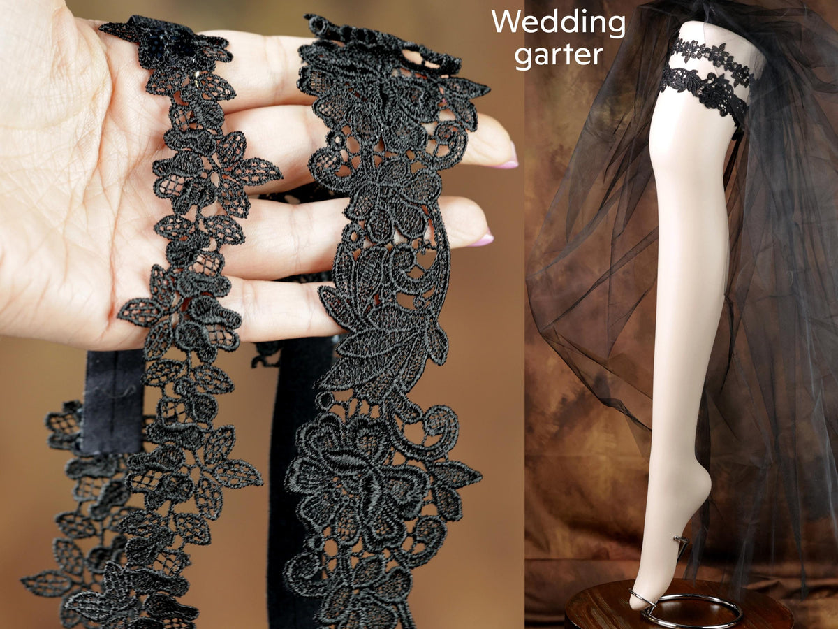 The image is a collage of two photos. In the first photo, a hand is holding a black lace garter with a floral pattern. In the second photo, a mannequin is wearing a black lace garter with a sheer veil.