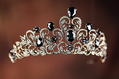 a tiara with black and white stones on it