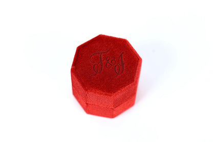 A red, octagonal box with the word "F&J" embossed on it.
