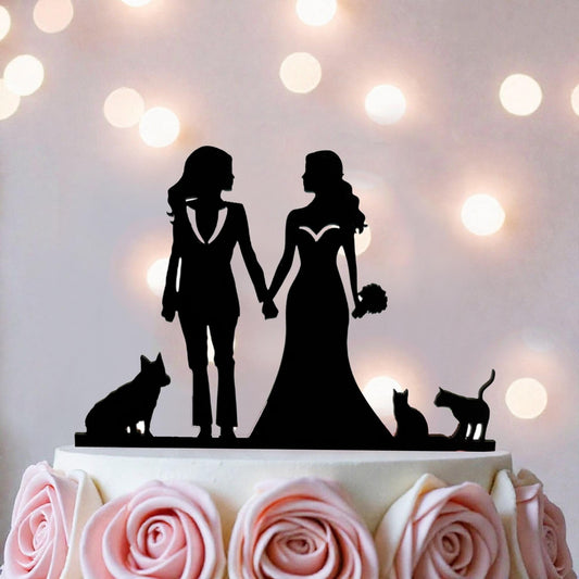 A silhouette of two women in wedding attire holding hands, with a dog and cat in the background, is the focus of the image.