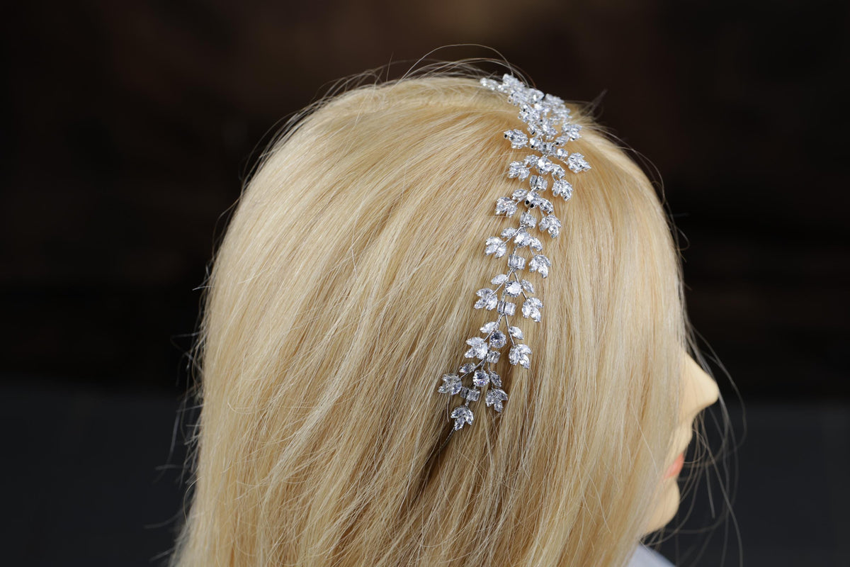 a blonde wig with a head piece made of crystal stones
