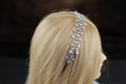 a blonde wig with a head piece made of crystal stones
