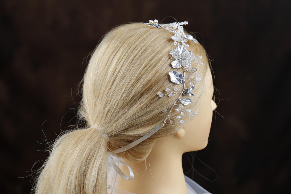 a blonde wig with a headband made of crystal stones