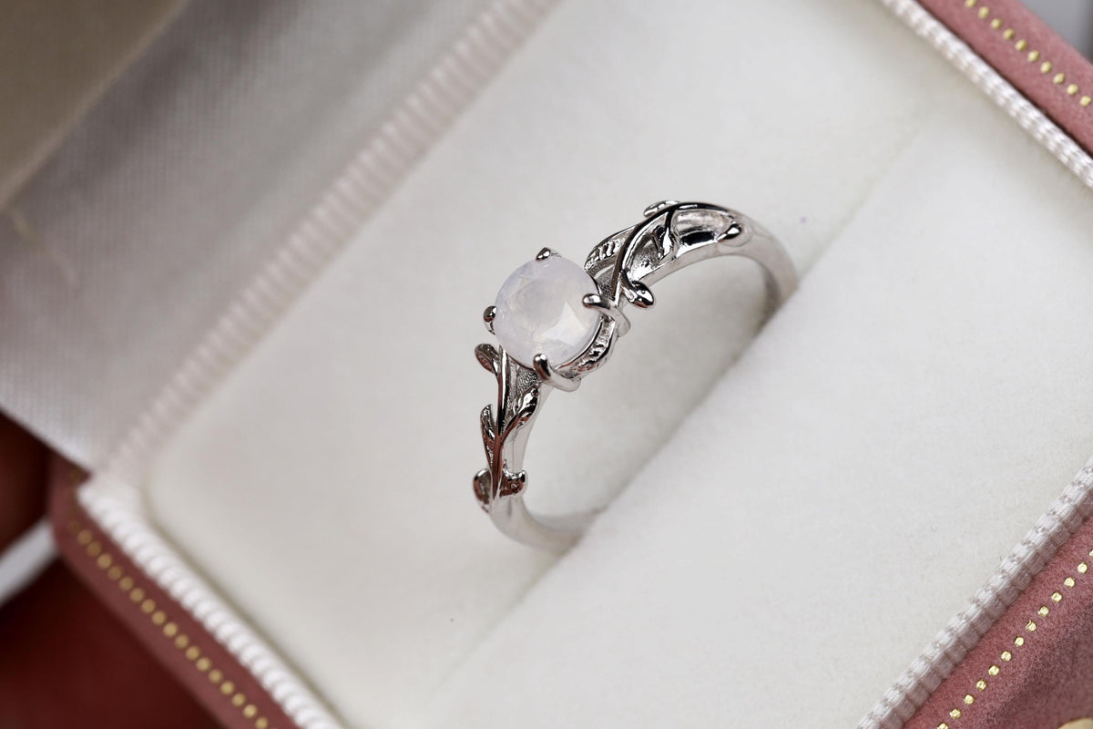 a close up of a ring in a box