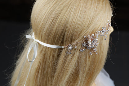a woman with blonde hair wearing a white headband