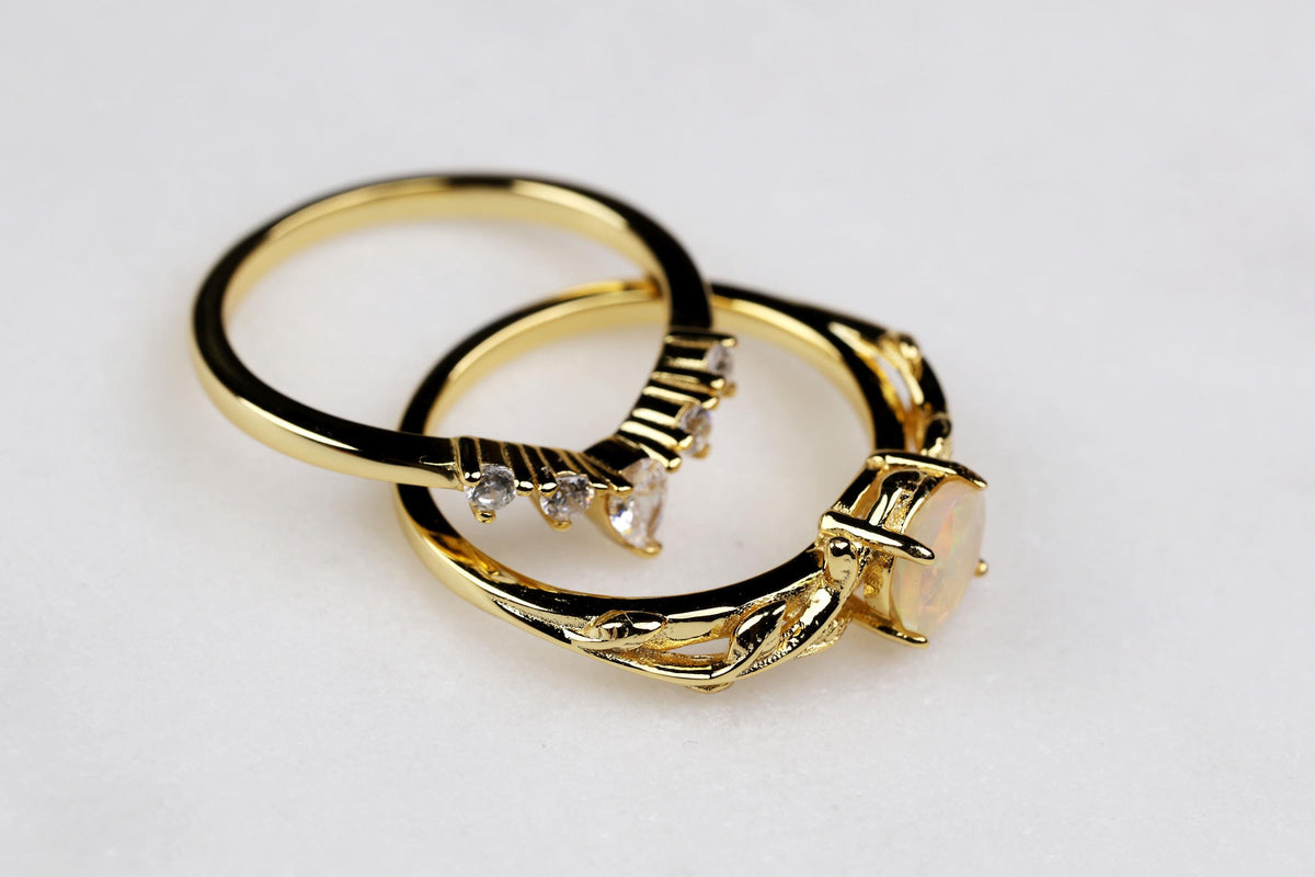 a couple of rings sitting on top of a white table