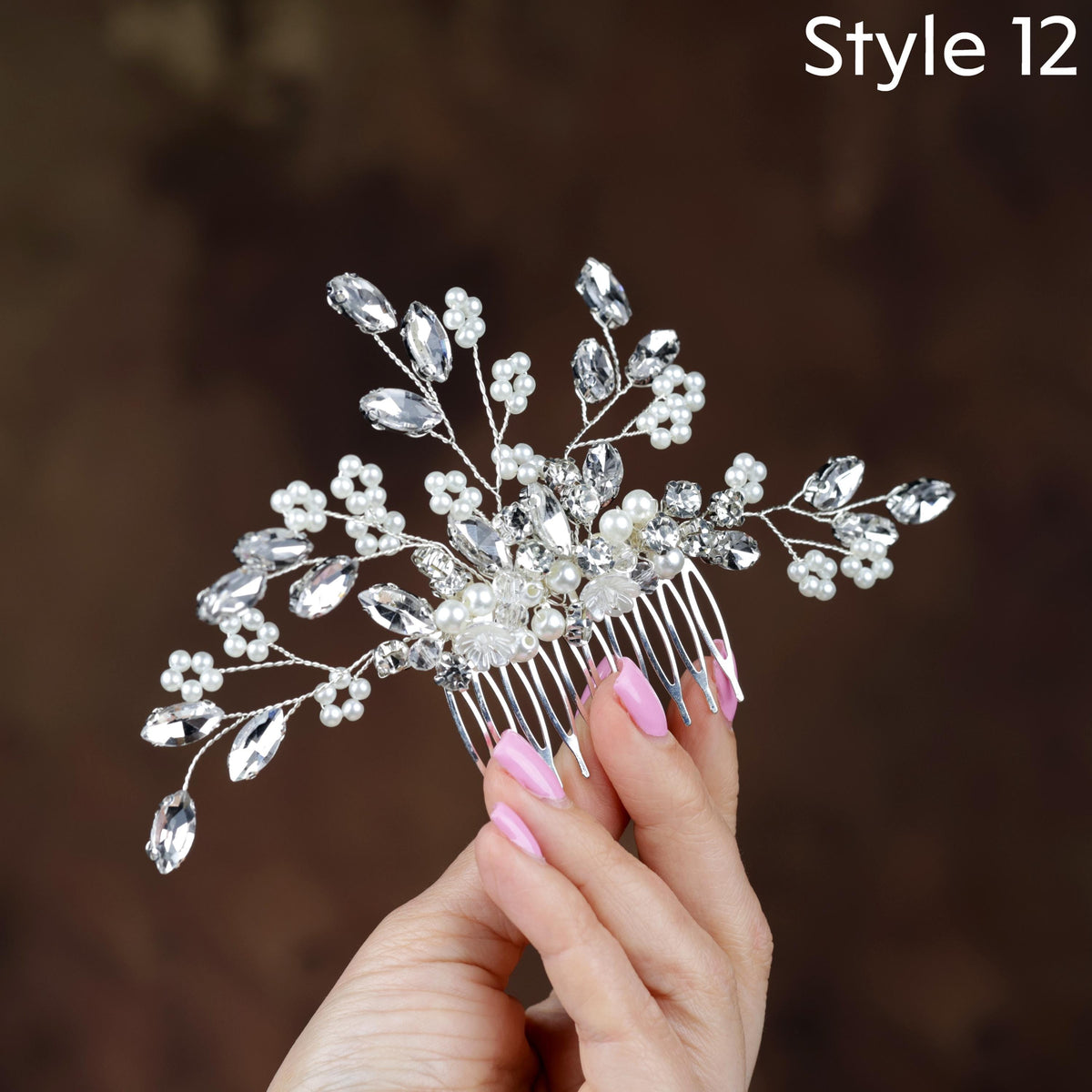 a close up of a person holding a hair comb