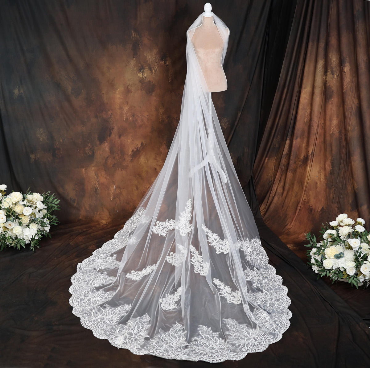 a bridal veil on a mannequin with flowers