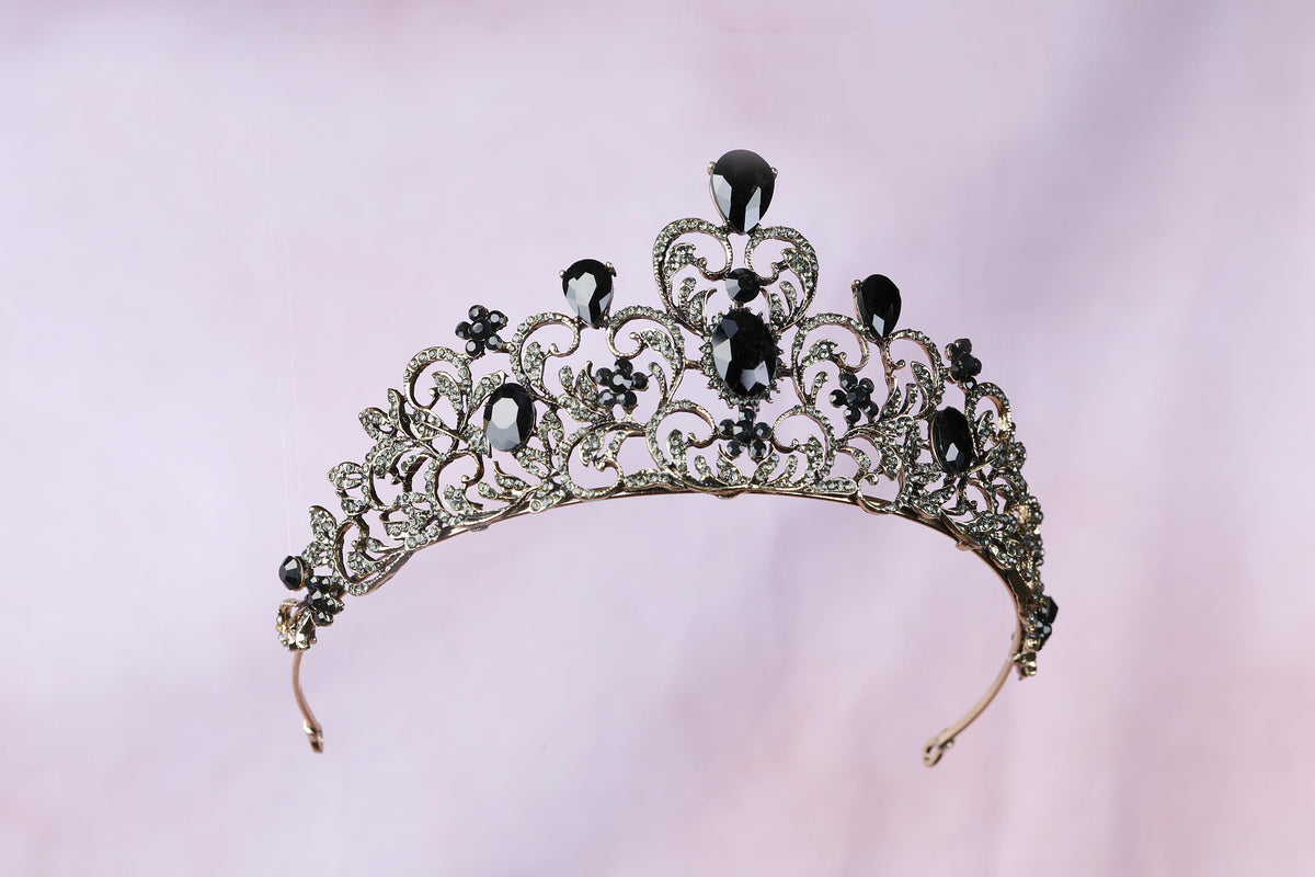 a tiara with black and white jewels on it