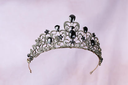 a tiara with black and white jewels on it