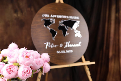 a wooden sign with a map of the world on it