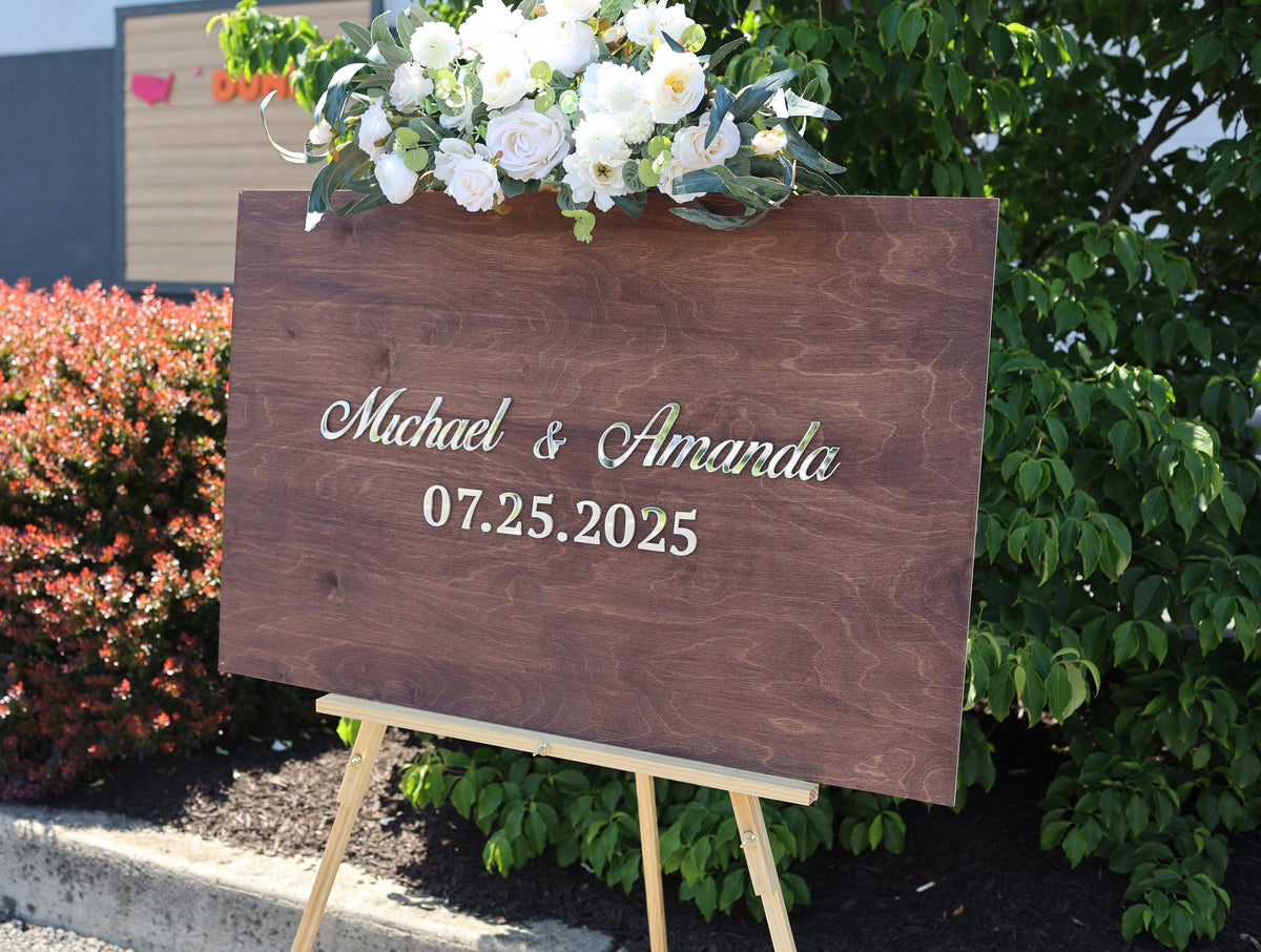 a wooden sign with a bouquet of flowers on top of it