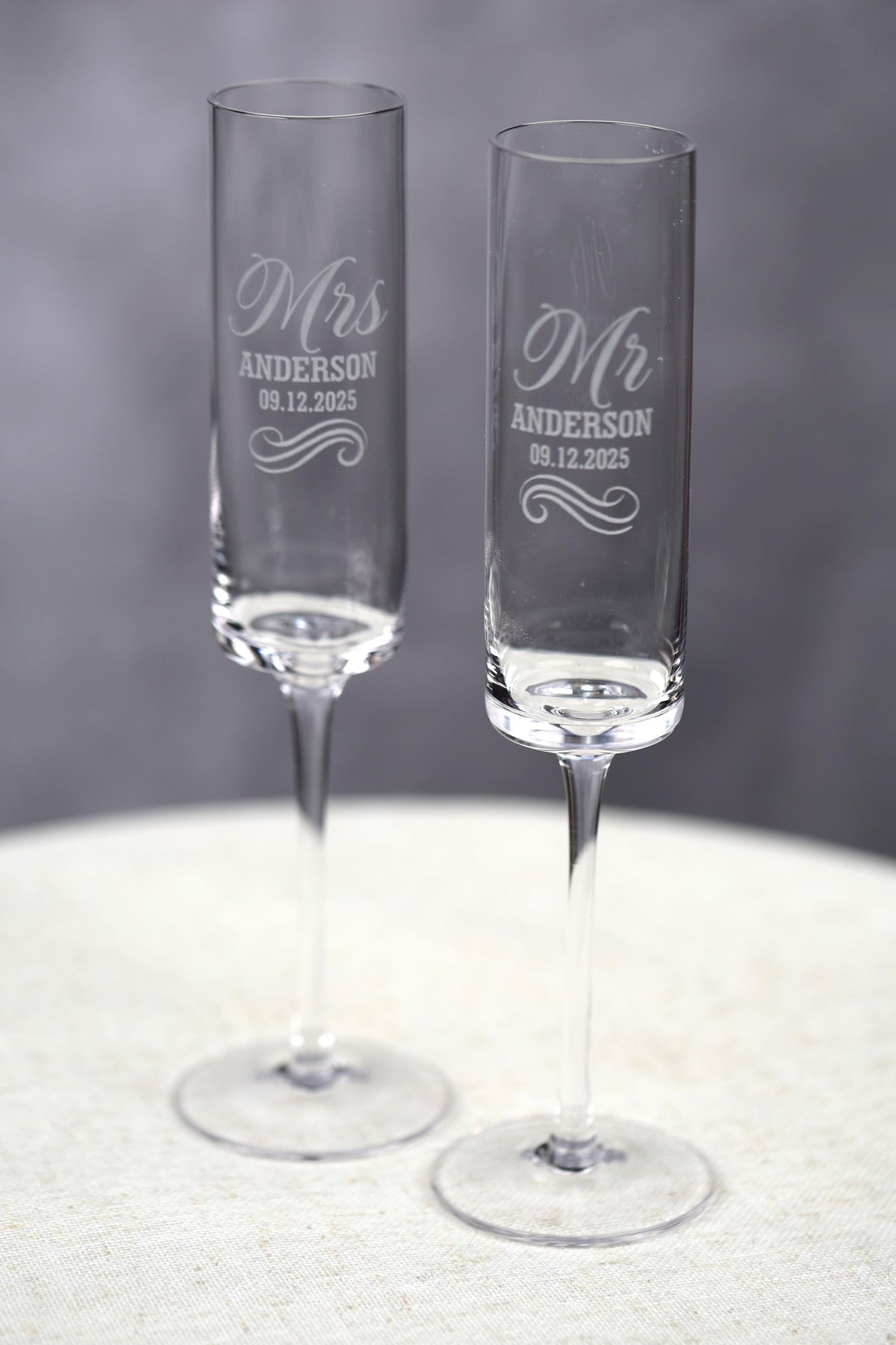 a couple of wine glasses sitting on top of a table