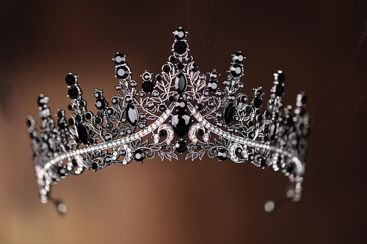 a black and white tiara on a brown background