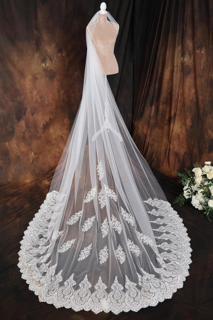 a wedding veil on a mannequin on a table