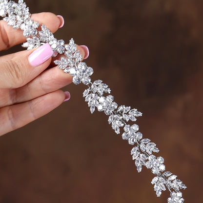 a close up of a person holding a tiara