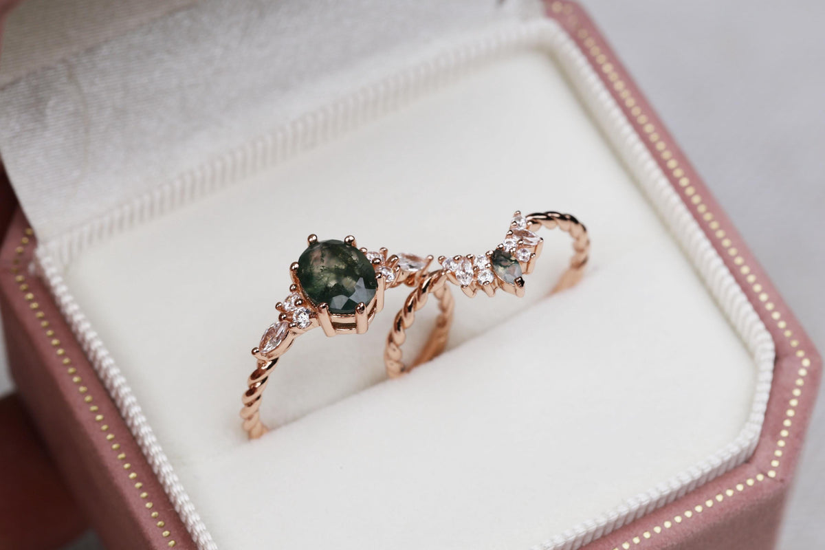 a couple of rings sitting inside of a box