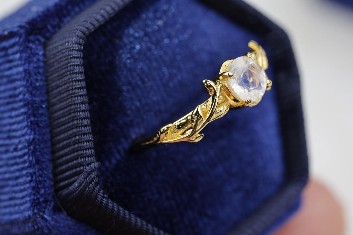 a close up of a ring in a box