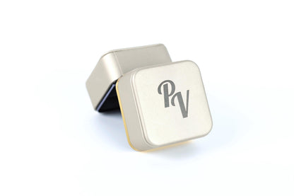 a square-shaped metal box with a logo on it.