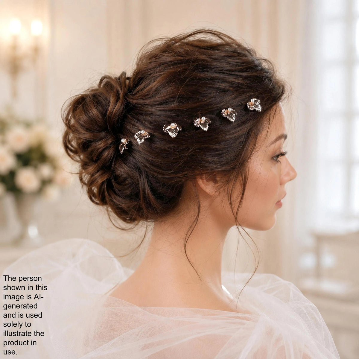 A woman with her hair styled in a bun, wearing a white dress and accessorized with a headband of small, clear gemstones.