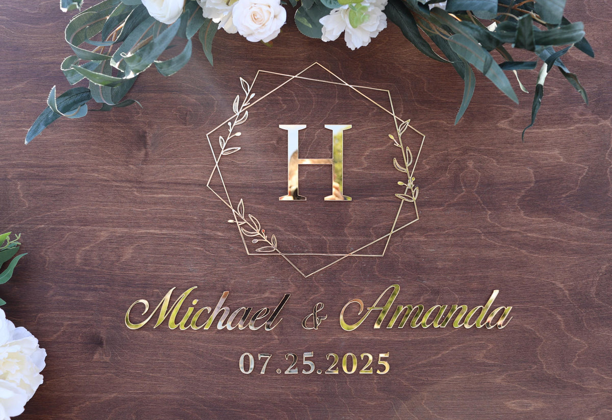 a wooden sign with a floral arrangement on top of it