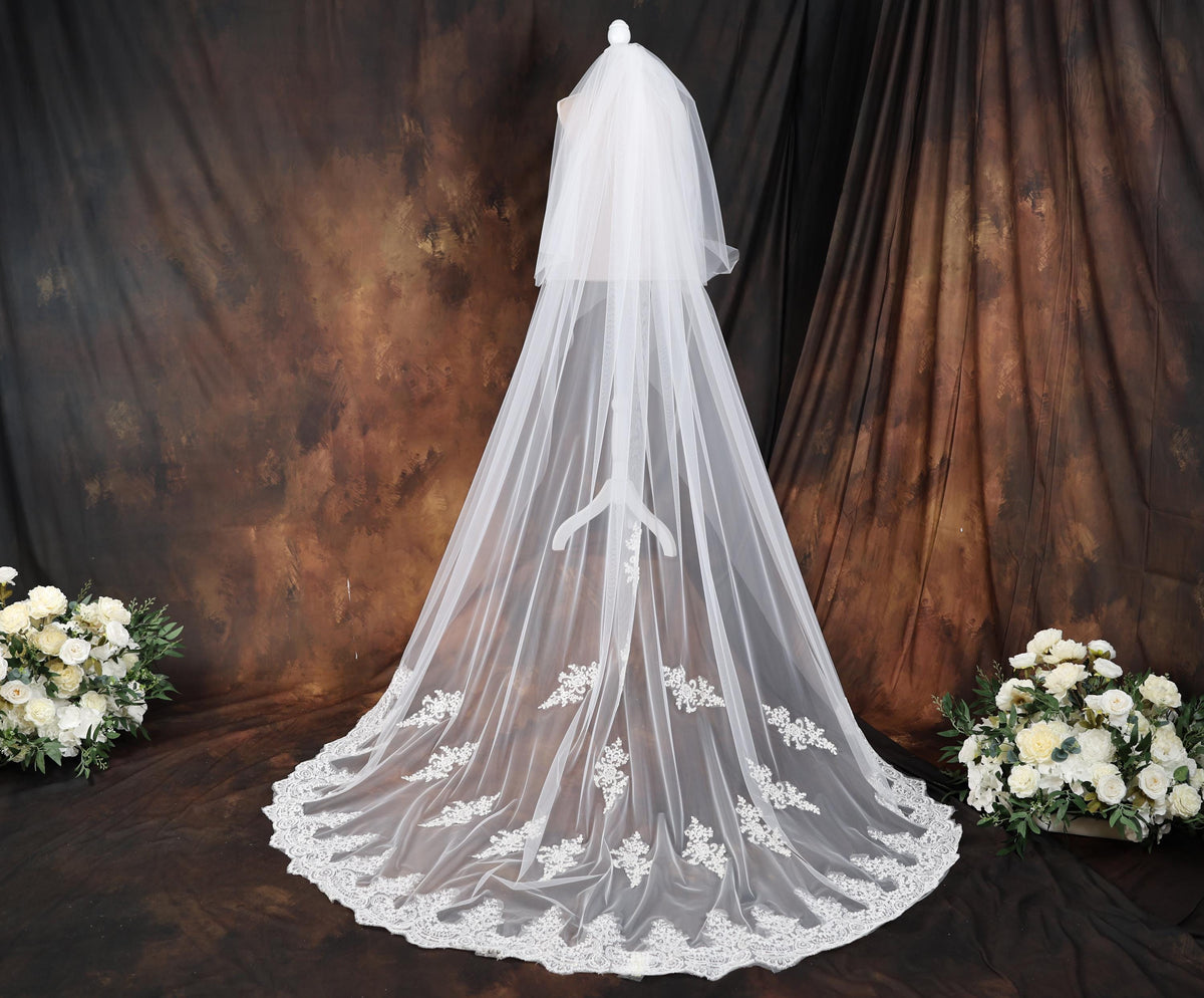 a bridal veil with a bouquet of white flowers
