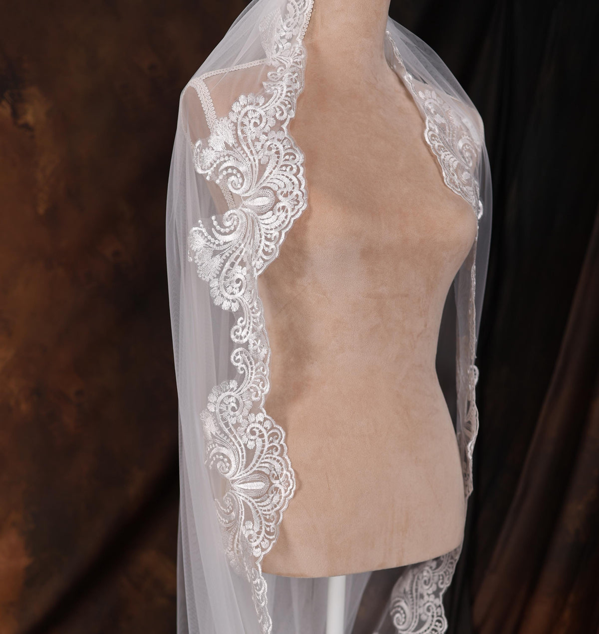 a mannequin with a white veil on top of it