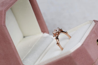 a close up of a ring in a box