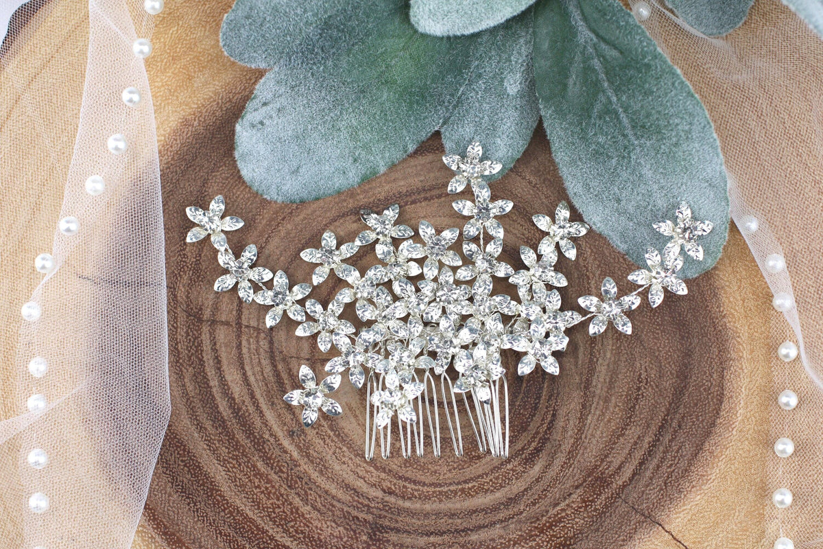 a close up of a hair comb on a piece of wood